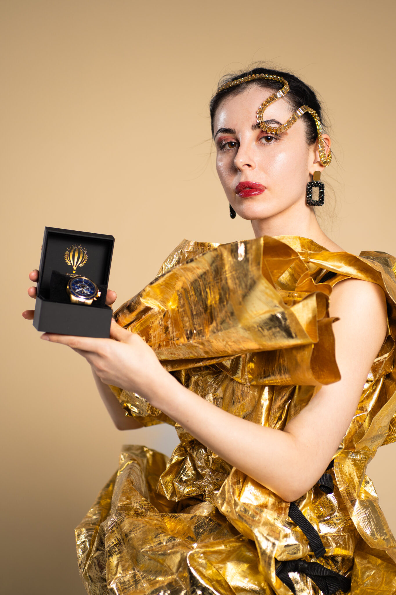 Gold editorial fashion portrait with product styling photographed in Berlin