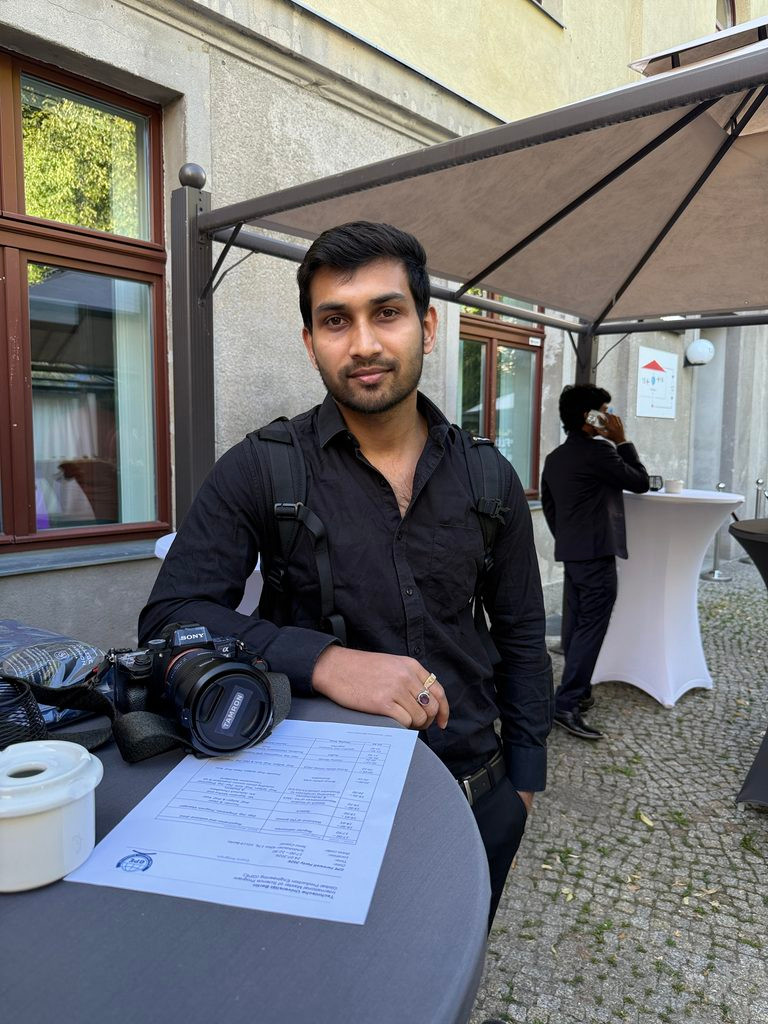 Nanda Kishore Ghosh, event photographer in Berlin, with his camera on site at TU Berlin's GPE Farewell Party 2026